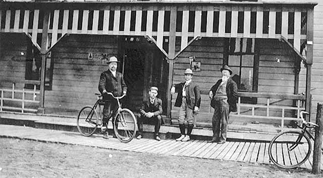 Men with bicycles at Forest Lake Minnesota, 1900