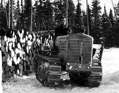 Skidding logs with a caterpillar at Hansen's Camp near Big Falls, 1950