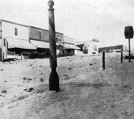 Street scene, Bovey, in a snowstorm, 1920