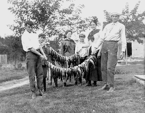 Young people with strings of fish, Cass Lake Minnesota, 1905