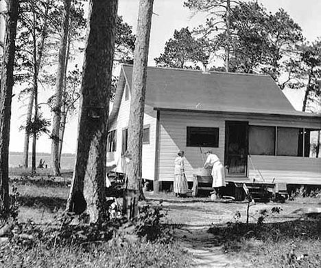 Anna and Ida Neils doing laundry at rented cottage on Norway Beach, Cass Lake Minnesota, 1912