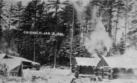 Log cabins in the woods, possibly E.J. Longyear operation, Chisholm. 1900
