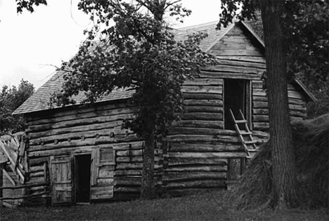 Two story log cabin at Climax Minnesota, 1938