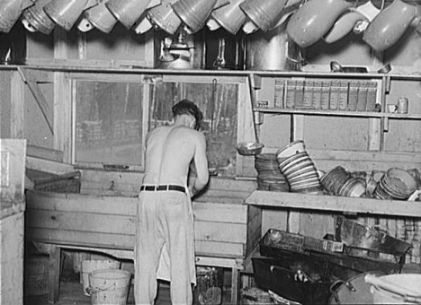 Washing dishes in a logging camp, Effie Minnesota, 1944