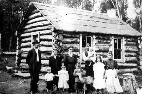 Haveri family in front of their log home, Finland Minnesota, 1900