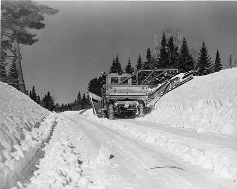 Wedge and wing plow widening road 3 miles west of Finland, 1939