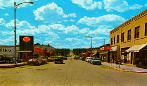 Main Street looking west to Highway 61, North Shore Drive as it enters the village from Duluth, Grand Marais, 1958