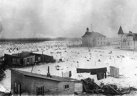 Schoolhouse, Methodist Episcopal Church and shacks, Hibbing Minnesota, 1900