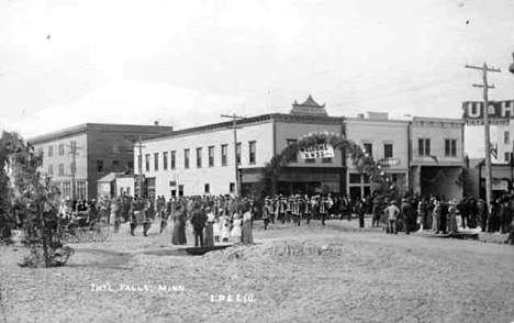 Street scene showing parade welcoming Northern Minnesota Development Association, International Falls Minnesota, 1900