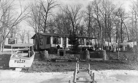 Cabin and Boat, Isle Minnesota, 1940's?