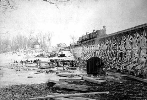 St. Paul, Duluth Railroad construction train on railroad bridge, Lindstrom, 1880