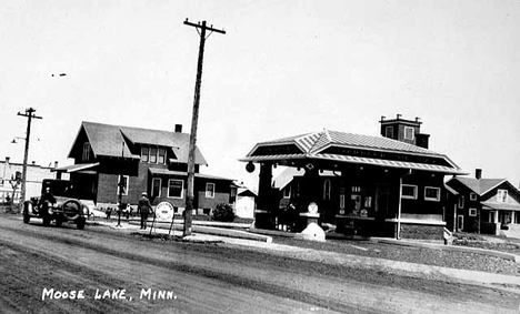 Standard Oil Company gas station and nearby residences, Moose Lake, 1925