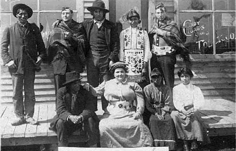 Chippewa Indians seated in front of Einen's Store, Onamia Minnesota, 1910