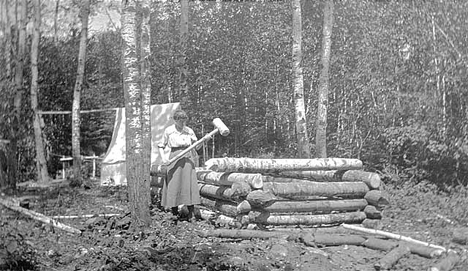 The making of Mr. Powers' log cabin, near Orr Minnesota, 1918