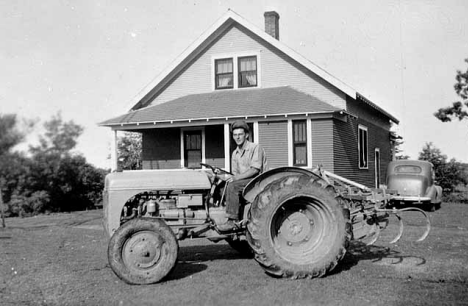 Alfred Pella on tractor, Pierz Minnesota, 1944