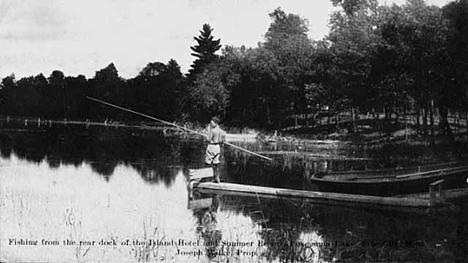 Fishing from the rear dock of the Island Hotel and summer resort, Pokegama Lake, Pine City Minnesota, 1908