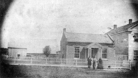 Grandma Frazier brick house, livery stable in background, Preston Minnesota, 1865