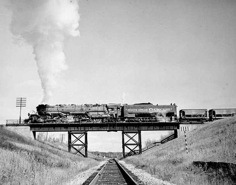 Duluth, Missabe and Iron Range train on railroad bridge west of Two Harbors, 1940