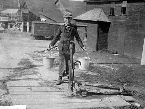 Water boy at a lumber mill in Winton Minnesota, 1890