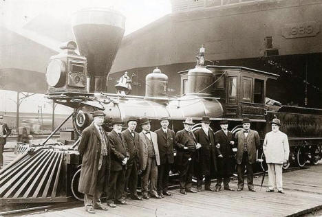 William Crooks in front the William Crooks Locomotive, the first train to operate between Minneapolis and St. Paul in 1862. Photo believe to be 1890's.