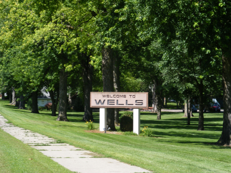 Welcome sign, Wells Minnesota, 2014