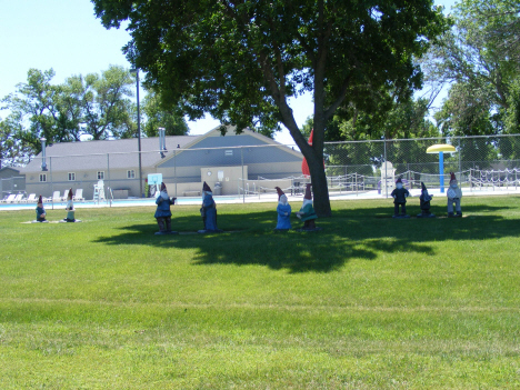 Gnomes with swimming pool in background, Dawson Minnesota, 2014
