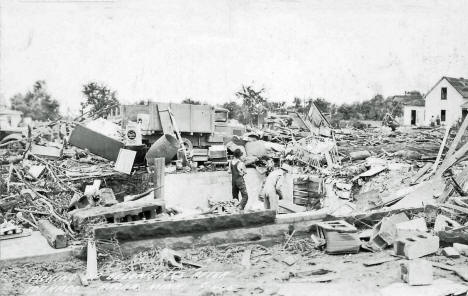 Picking up belongings after the tornado, Anoka Minnesota, 1939