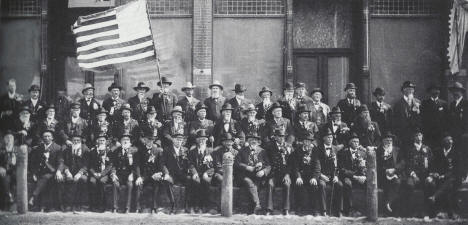 Member of the D.F. Markham Post No. 7 Grand Army of the Republic in from of Addison Hardware on Main Street in Marshall Minnesota, 1900