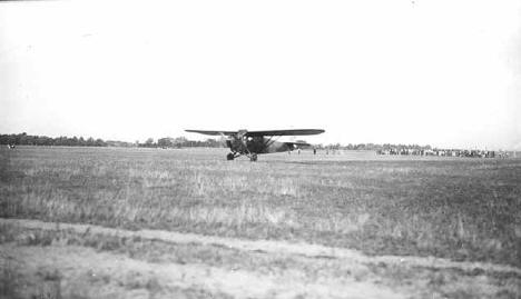 Airplane in field, Lindbergh visit to Little Falls Minnesota, August 25th, 1927