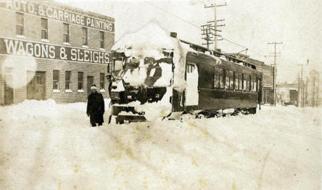 St. Paul Southern interurban is plastered with snow in downtown Hastings after a winter run from St. Paul, 1915